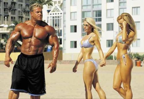 Bodybuilder and Two Girls